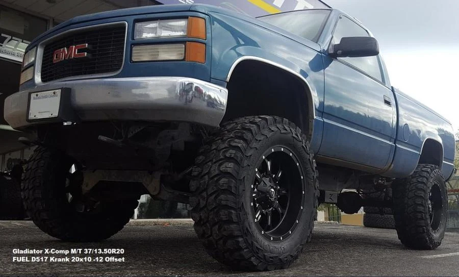Blue GMC lifted pickup at Tire Capital in Prince George. Fitted: Gladiator X-Comp M/T 37/13.50R20; FUEL D517 Krank 20x10 -12 Offset