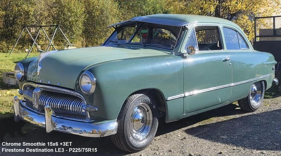 Green classic sedan at Tire Capital in Prince George. Fitted: Chrome Smoothie 15x6 +3ET; Firestone Destination LE3 - P225/75R15